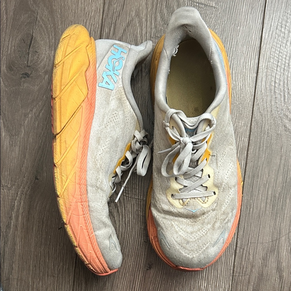 Hoka Sneakers with Orange and Yellow Highlights